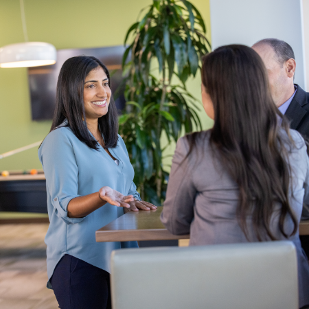 A woman smiling as she interviews for an open position at Prothena